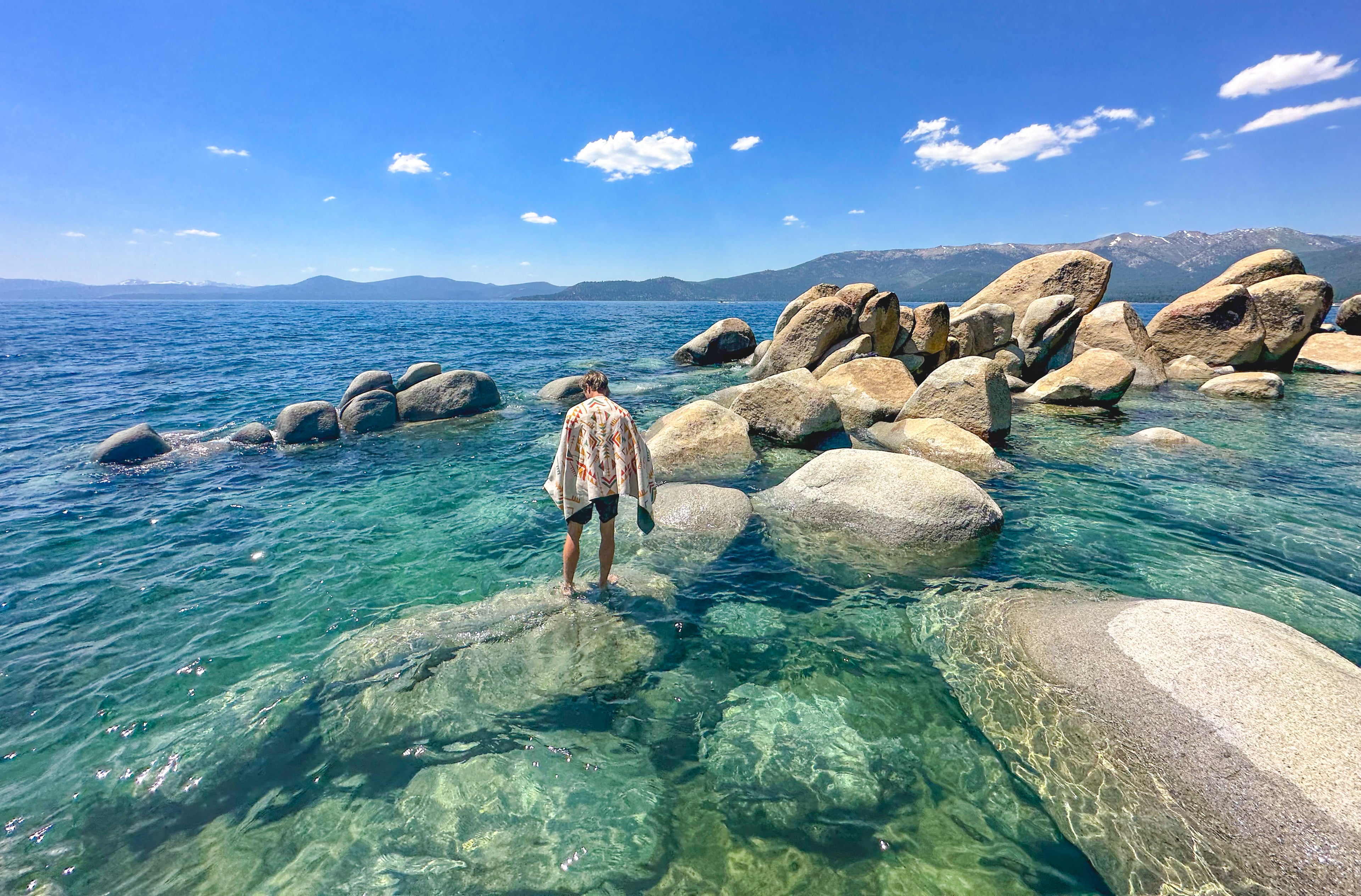 main website image with boondock sand free adventure beach towel on rocks